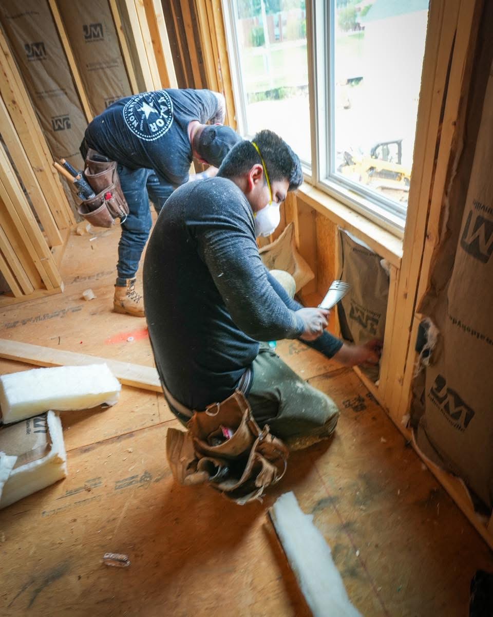 Valor crew installing fiberglass batt insulation in Powell TN